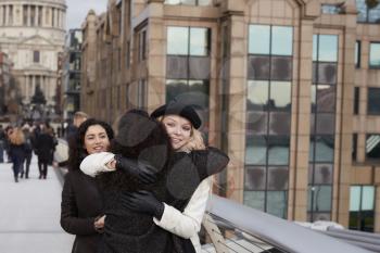 Group Of Female Friends Meeting On Winter Visit To London