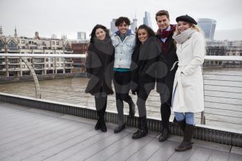 Portrait Of Young Friends Visiting London In Winter