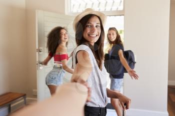 Point Of View Shot Of Female Friends Leaving Summer Rental