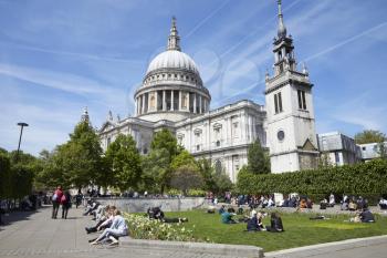 LONDON - MAY, 2017: People relaxing in Festival Gardens by St Pauls Cathedral, Ludgate Hill, London, EC4.