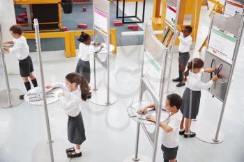 School kids doing science tests at a science centre