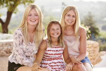 Portrait Of Three Sisters Having Fun On Holiday Together