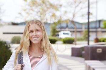 Portrait Of Female High School Student Outside College Buildings