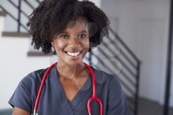 Portrait Of Female Nurse Wearing Scrubs In Hospital