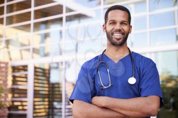 Young black male healthcare worker smiling outside, portrait