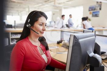 Hispanic woman working in a call centre