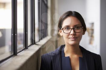Young mixed race businesswoman wearing glasses, portrait
