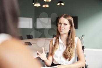 Businesswoman Interviewing Female Candidate At Graduate Recruitment Assessment Day In Office
