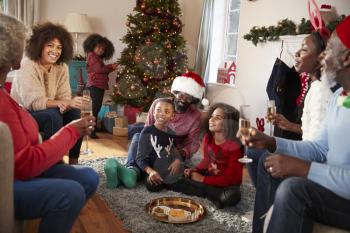 Multi Generation Family Celebrate Christmas At Home Together