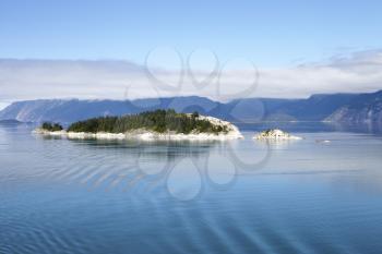 Forested Island On Lake In Alaska Surrounded By Mountains