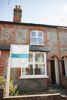 Real Estate Sold Board Outside Terraced House