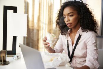Busy Businesswoman With Laptop Sitting At Desk Having Working Lunch Sandwich