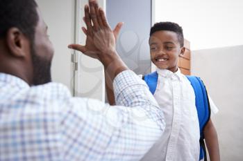 Father Giving Son High Five As He Leaves For School