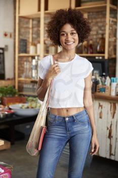 Portrait Of Woman Shopping In Sustainable Plastic Free Grocery Store