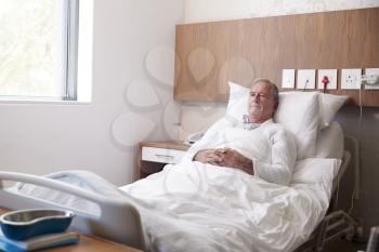 Senior Male Patient In Hospital Bed In Geriatric Unit