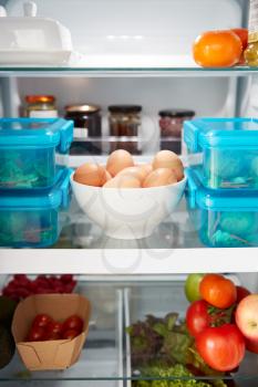 View Inside Refrigerator Of Healthy Food And Packed Lunches In Plastic Containers