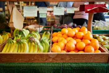Display Of Bananas And Oranges In Organic Farm Shop
