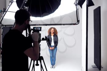 Female Model Working On Set In Photographic Or Film Studio