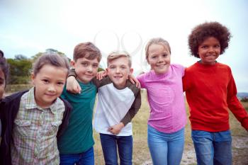Portrait Of Children On Outdoor Activity Camping Trip Having Fun Playing Game Together