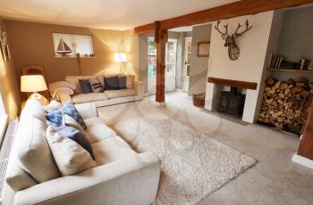 Interior View Of Beautiful Lounge With Sofas And Log Burner In Family House