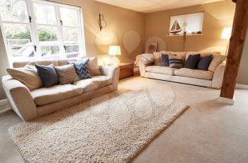 Interior View Of Beautiful Lounge With Sofas And Soft Furnishings In Family House