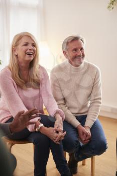 Mature Couple Attending Support Group Meeting For Mental Health Or Dependency Issues