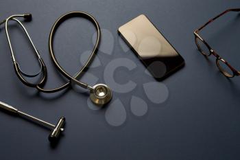 Overhead Flat Lay Shot Of Medical Equipment On Black Background