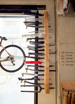 Rack Containing Assortment Of Bicycle Forks In Workshop