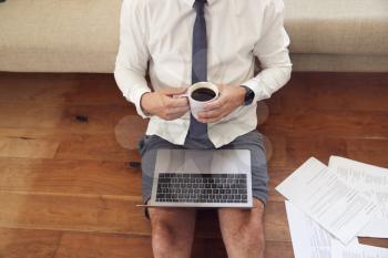 Close Up Of Businessman Wearing Loungewear And Shirt And Tie On Laptop Working From Home