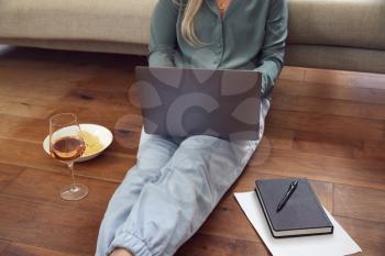 Close Up Of Businesswoman At End Of Day With Wine In Loungewear And Suit On Laptop Working At Home