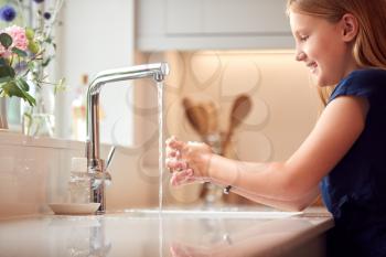 Girl Washing Hands With Soap At Home To Prevent Spread Of Infection In Health Pandemic