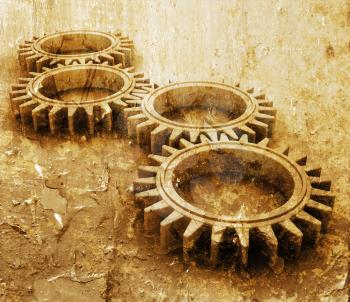 Royalty Free Clipart Image of Interlocking Gears on a Grunge Background