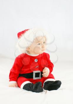 Cute baby boy in a santas outfit