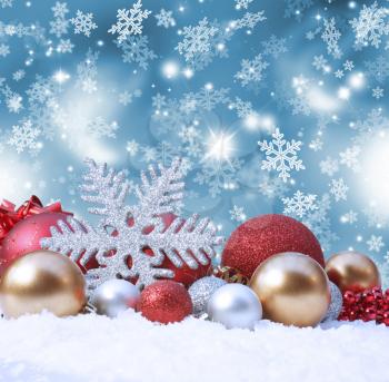 Decorative christmas background with decorations in snow
