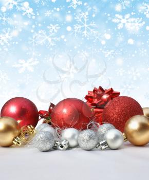 Christmas decorations on snowflake background