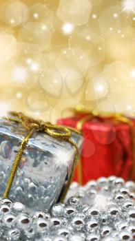 Christmas gifts on glittery gold background