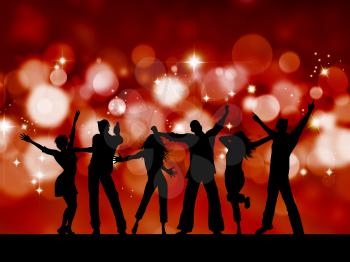 Silhouettes of people dancing on blurred lights background