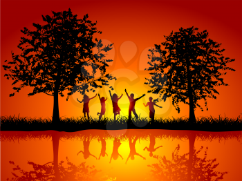 Silhouettes of children playing outside alongside a river