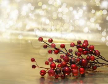 Christmas background with red berry decorations with bokeh lights