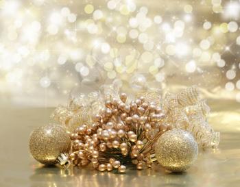 Christmas background with gold decorations and bokeh lights