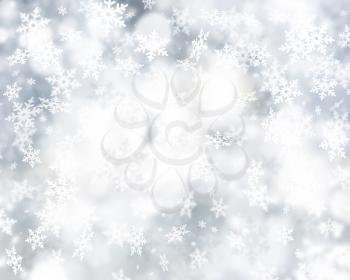 Silver Christmas background of falling snowflakes