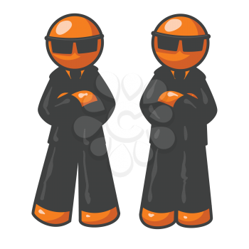 Two orange men wearing suits that are dark black. 