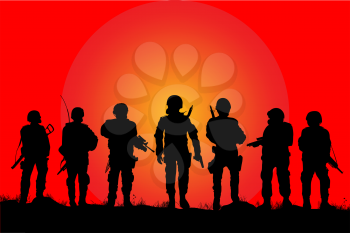 Soldiers silhouettes on a filed in the sunset