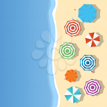 Aerial view of a summer beach with colored umbrellas and toys, slippers and room for your text