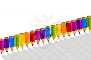 Watercolor pencils in rainbow colors, in a row over white background