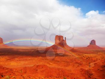 Royalty Free Photo of a Rainbow in Monuments Valley  in Navajo