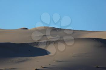 Royalty Free Photo of The Phenomenon of Death Valley, California - a Huge Sand Dune Eureka, Before Sunrise. Delightful alternation of light and shade
