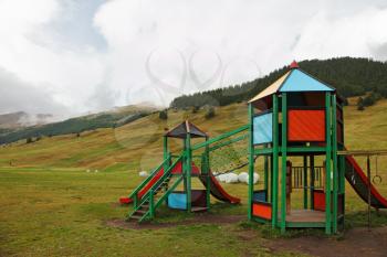 Park attractions for children at the prestigious mountain resort in the Alps. Beginning of autumn
