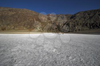 Tourists are photographed on a hydrochloric plateau in Death valley
