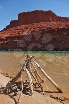 The ritual construction of the Navajo dry poles and sticks. The banks of the Colorado River.